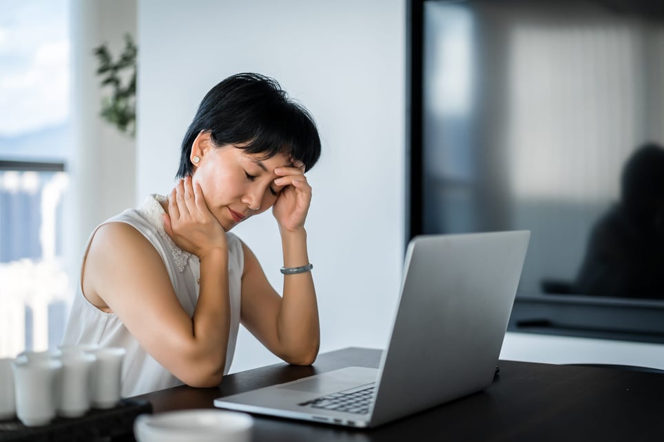 An-Asian-woman-shows-fatigue-in-the-office-why-am-i-so-tired-all-the-time