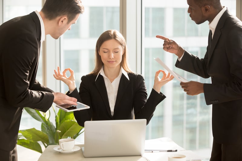 Beautiful-businesswoman-meditating-at-workplace-endurance-vs-resilience