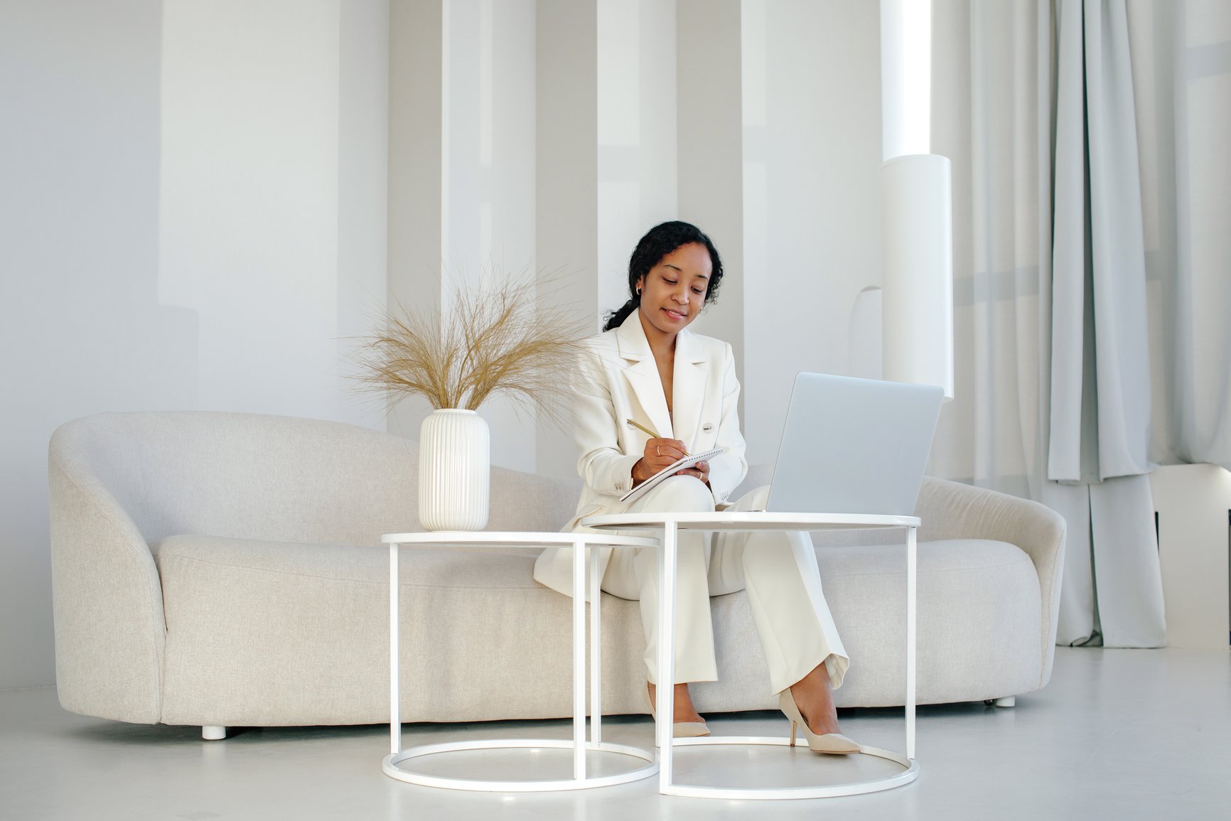 Black-Female-Manager-Taking-Notes-In-Office