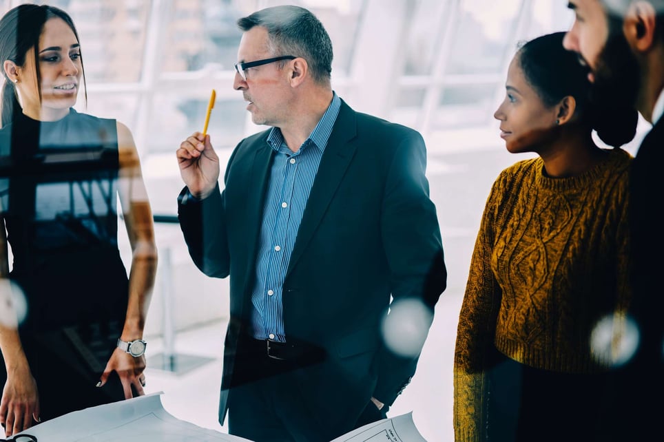 Business-man-talking-seriously-to-woman-coworker-signs-your-coworker-is-threatened-by-you-and-how-to-deal-with-it