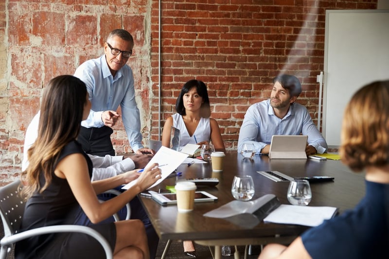 Business-team-in-a-meeting-concentration-exercises_11zon