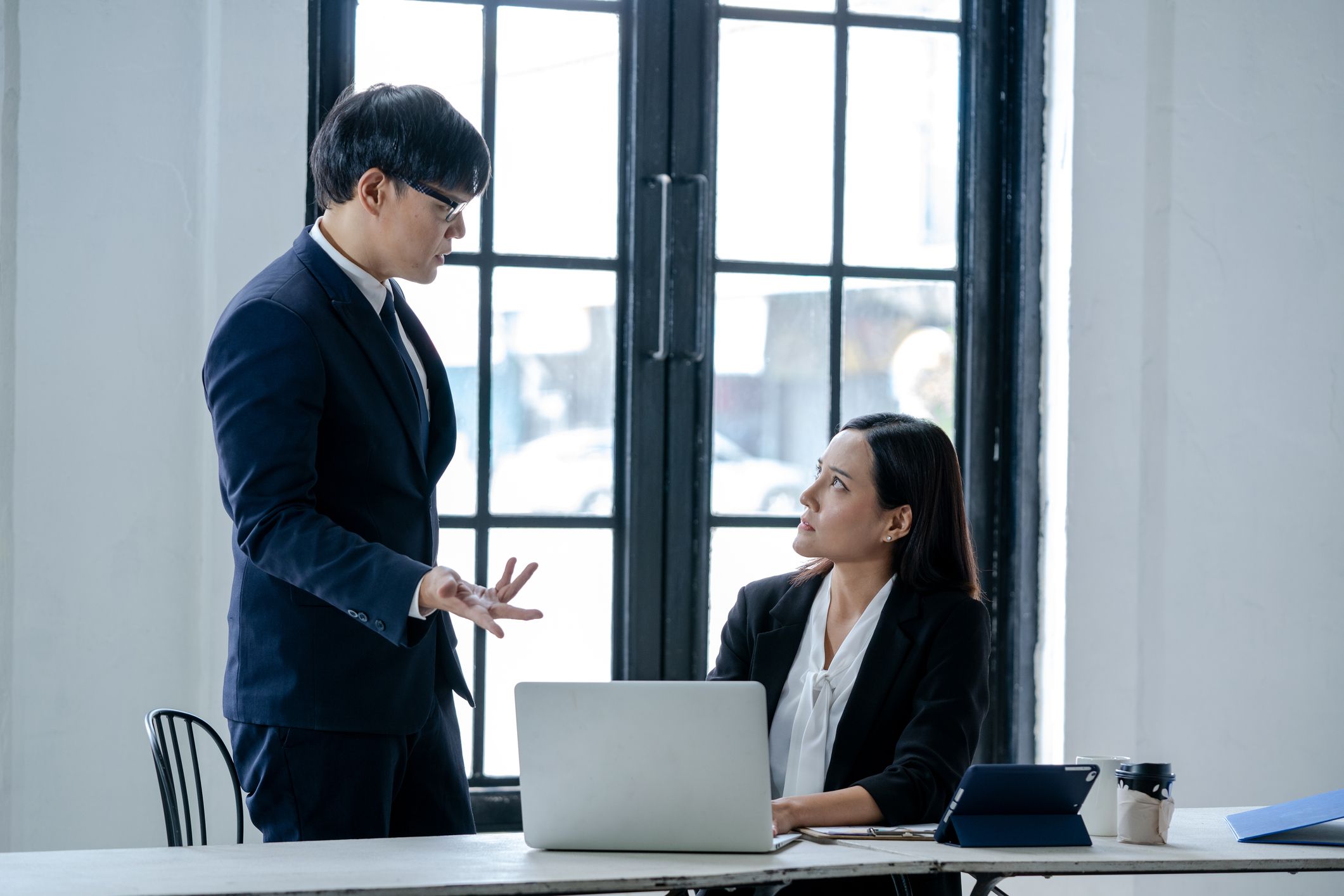 Business-woman-sitting-sad-and-solving-problem-with-manager-listening-skills