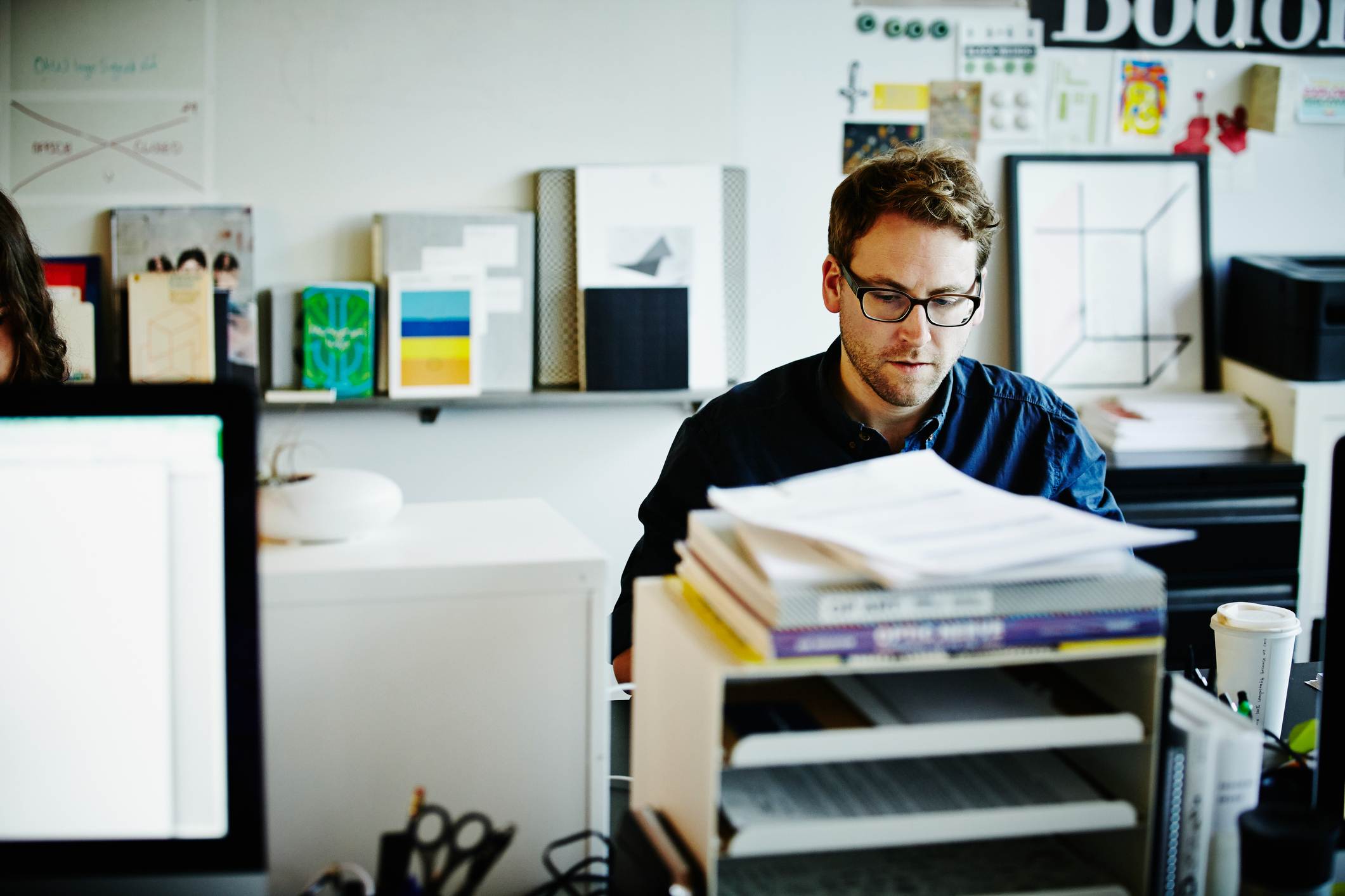 Businessman-sitting-at-workstation-of-startup-office-working-on-project-on-laptop-how-to-make-an-action-plan-to-achieve-goals