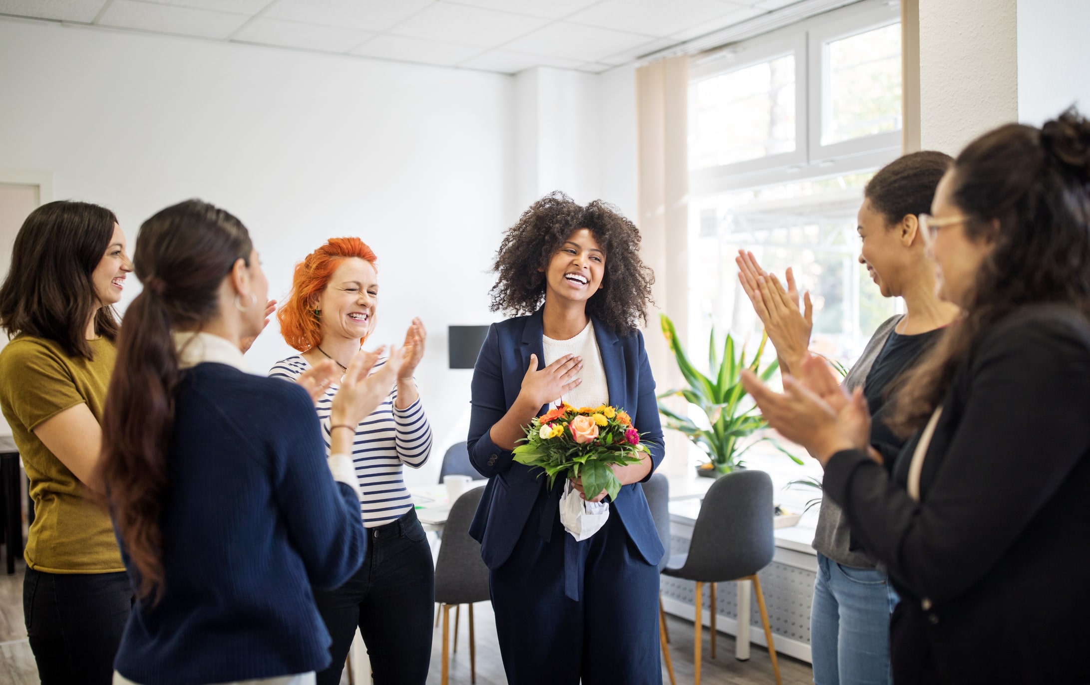 Businesswomen-celebrating-an-achievement-of-a-colleague-find-your-purpose