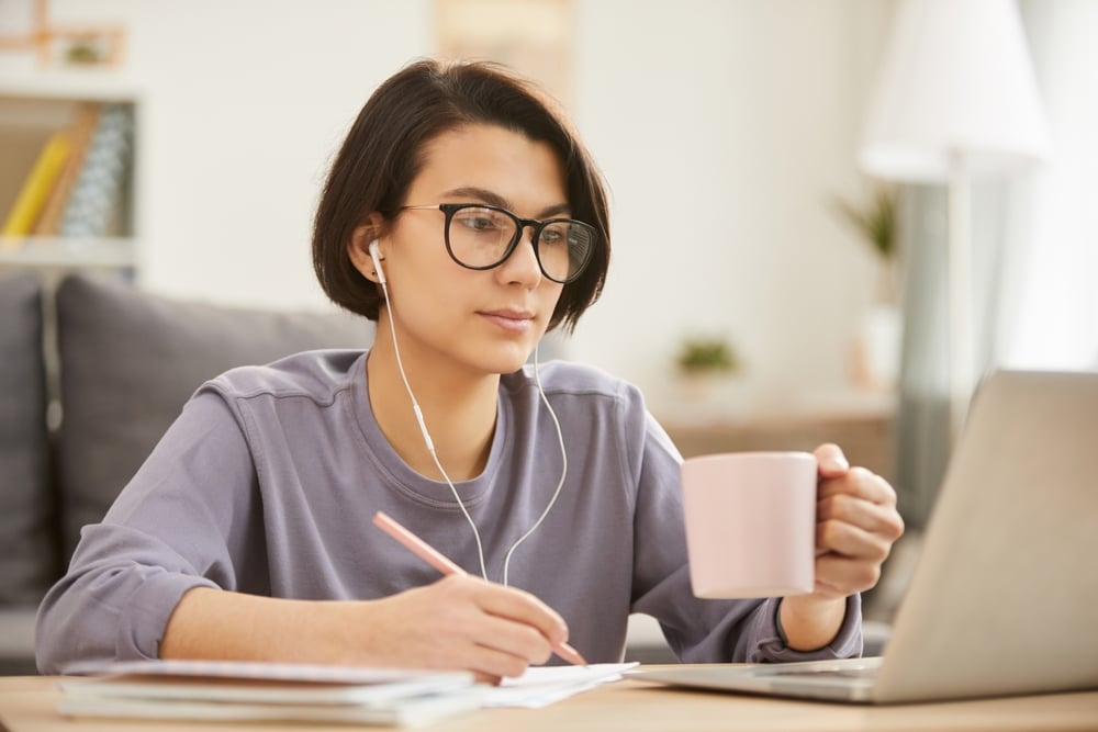 Busy-young-female-transcriptionist-in-earphones-best-work-from-home-jobs-for-moms