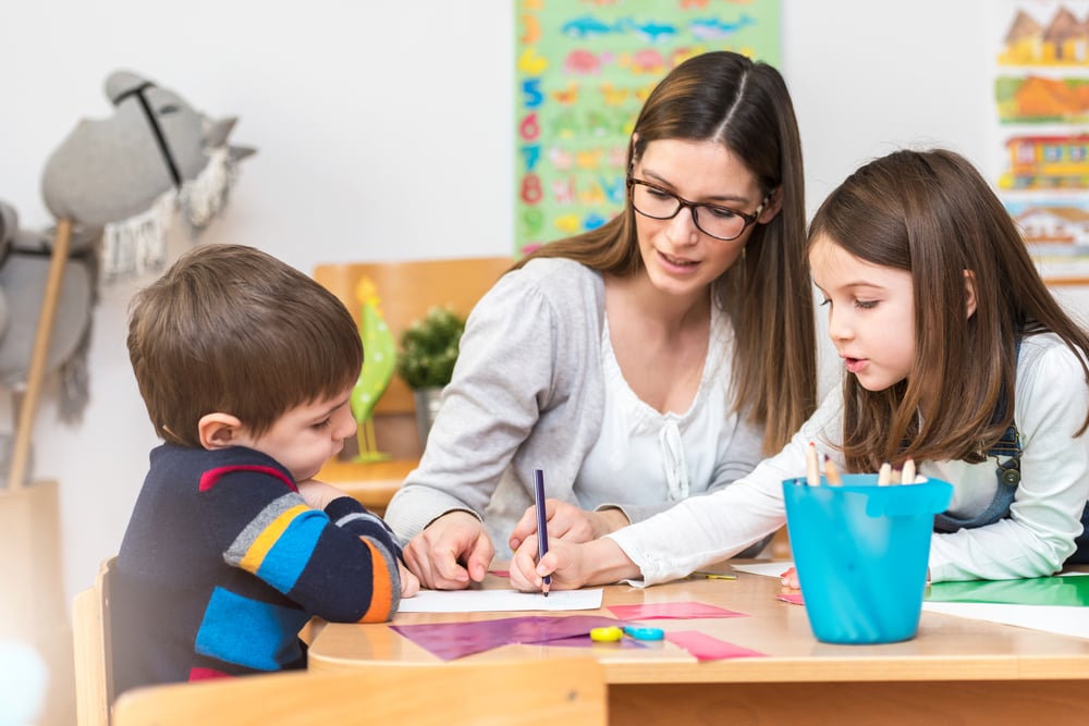 Children-in-childcare-with-woman-how-to-be-a-working-mom