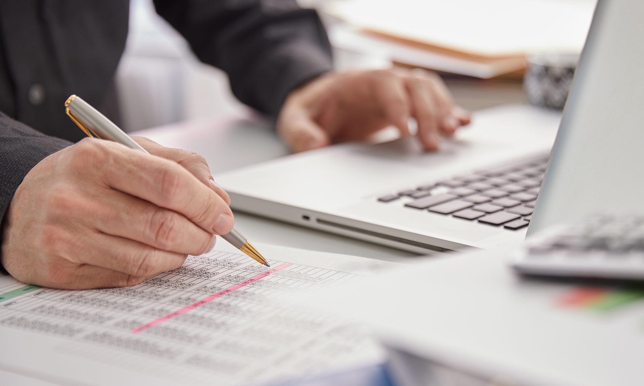 Close-up-of-accountant-hands-writing-down-numbers-jobs-for-introverts