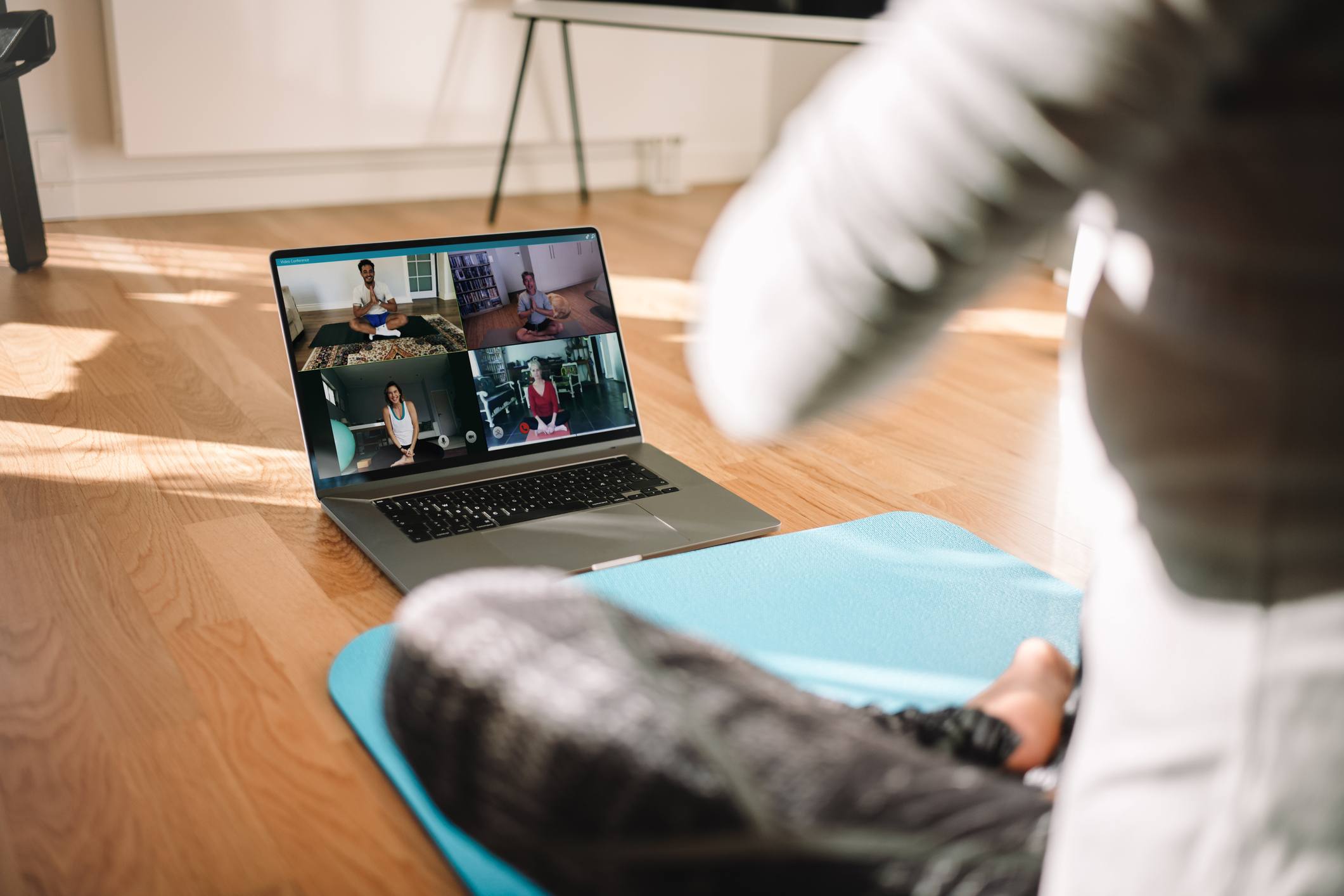 Close-up-of-womans-laptop-in-a-virtual-work-out-class-employee-health