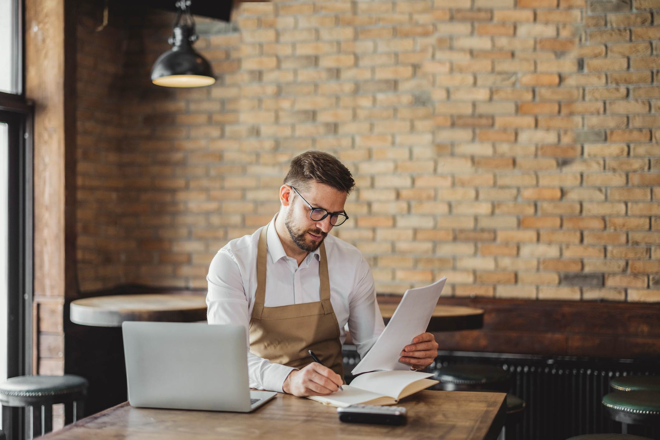 Coffee-Shop-Owner-doing-some-Paperwork-asking-for-a-raise-tips