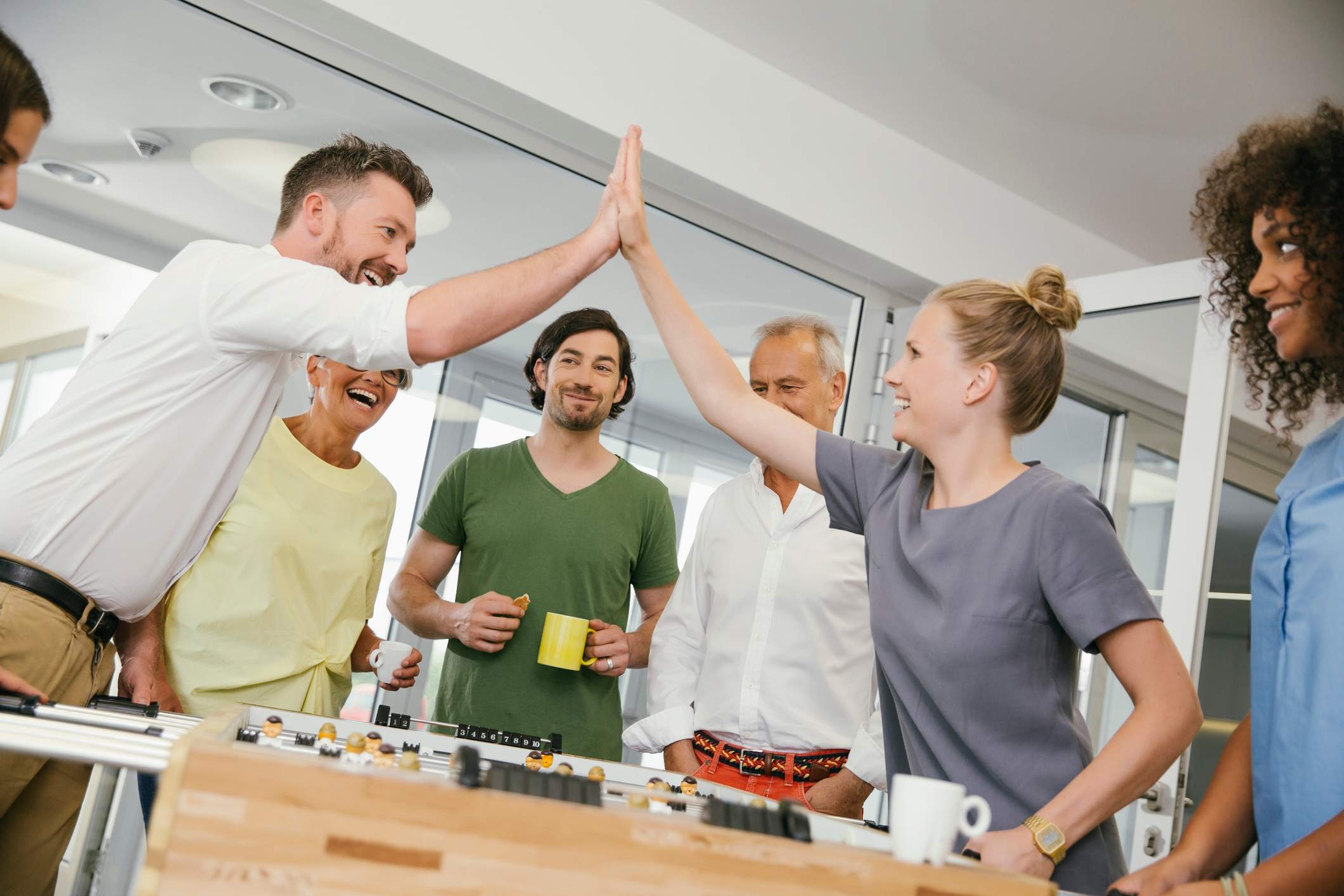 Collegues-giving-each-other-high-five-types-of-leadership-styles