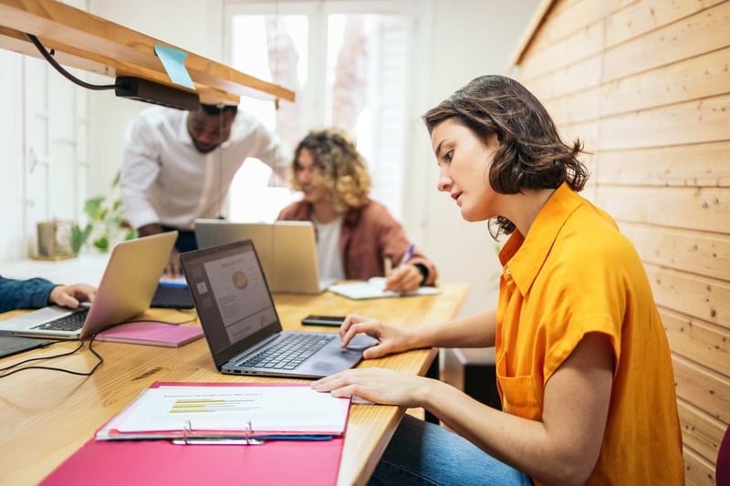 Concentrated-Woman-Working-With-Laptop-how-to-deal-with-difficult-coworkers