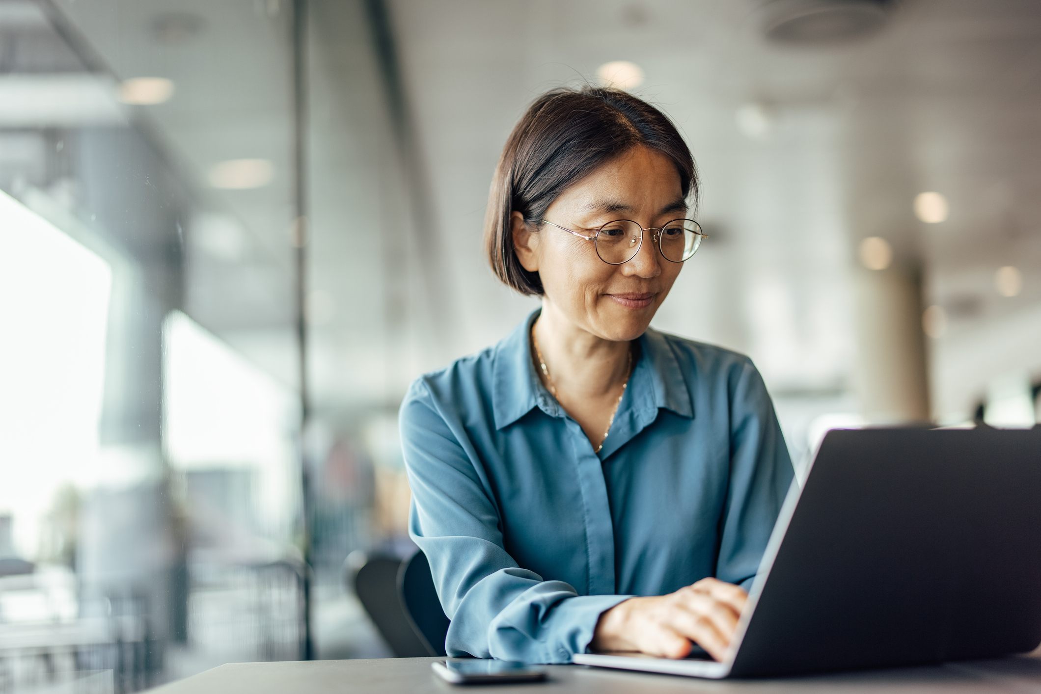 Confident-asian-woman-trying-to-help-her-customers——signs-you-are-being-pushed-out-of-your-job