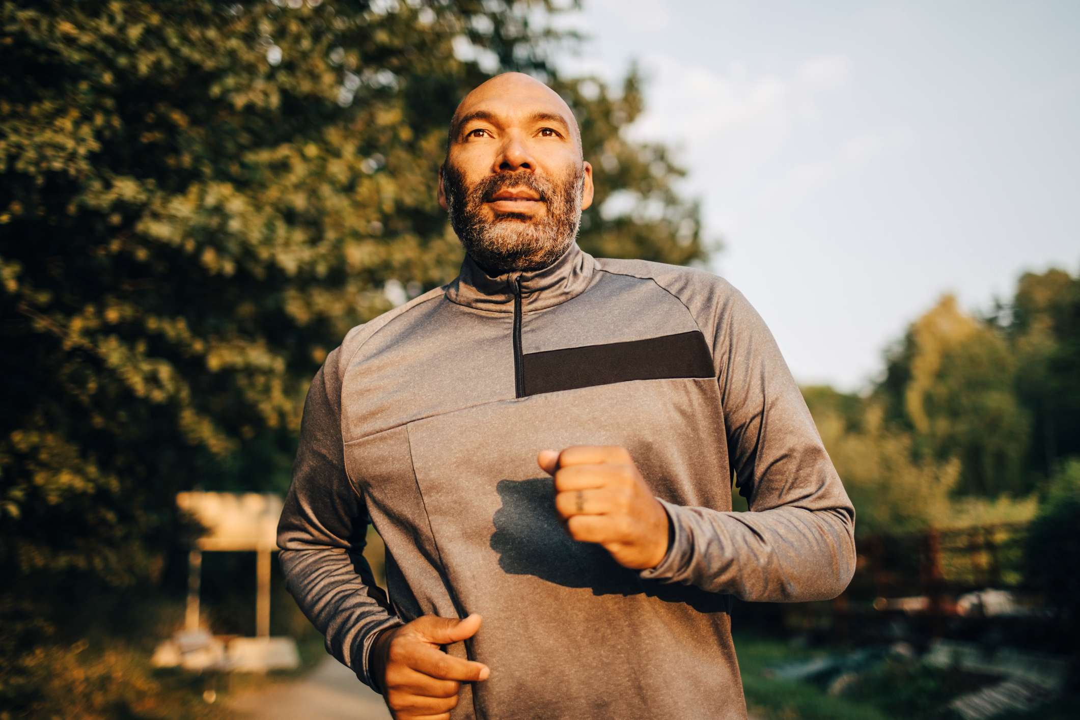 Confident-man-jogging-in-park-how-to-start-over-in-life-at-50