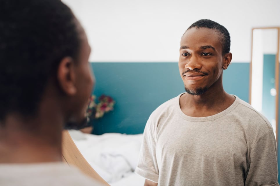 Confident-man-looking-at-himself-in-the-mirror-affirmations-for-imposter-syndrome