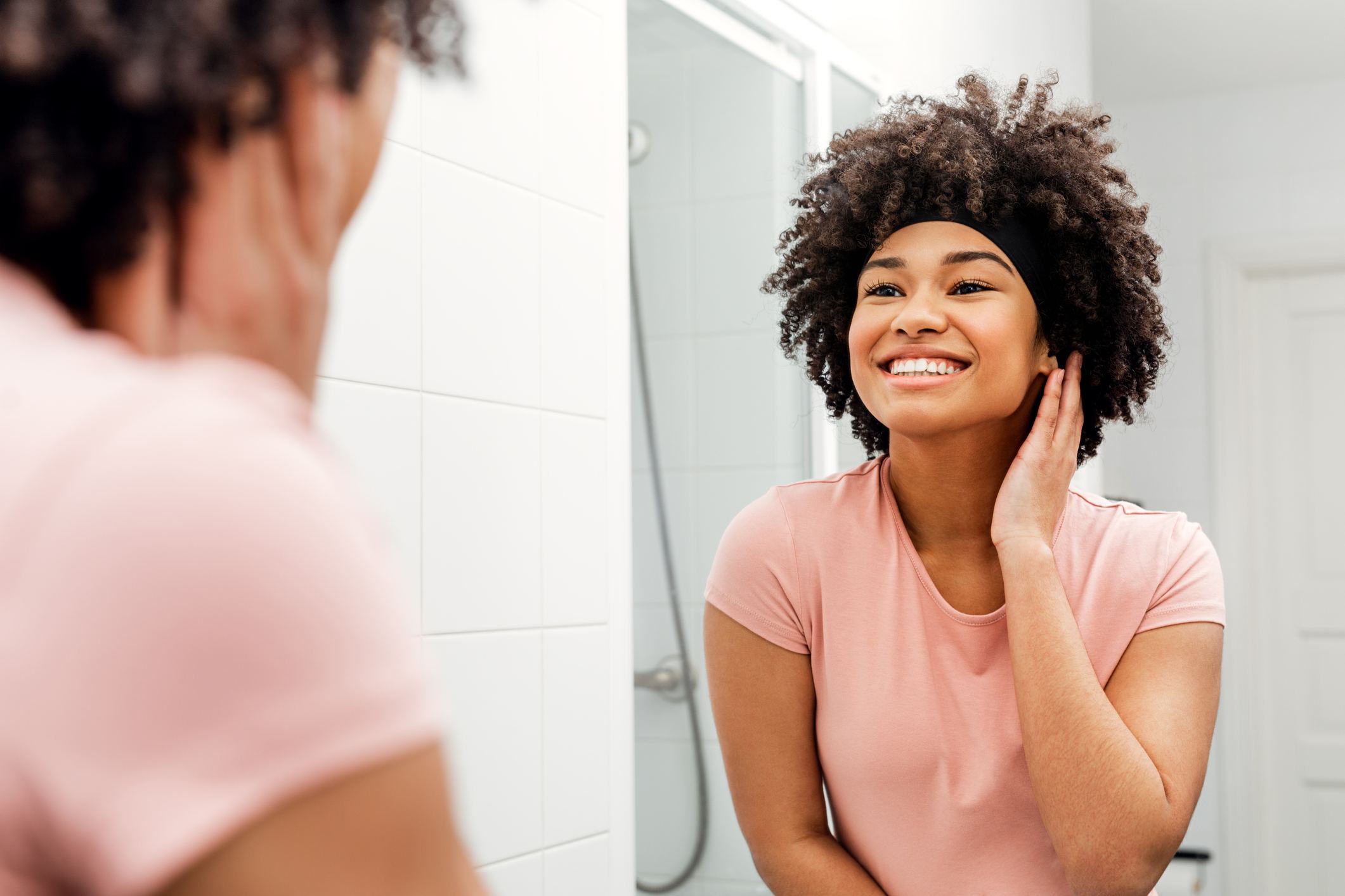 Confident-woman-looking-at-herself-in-the-mirror-networking-plan