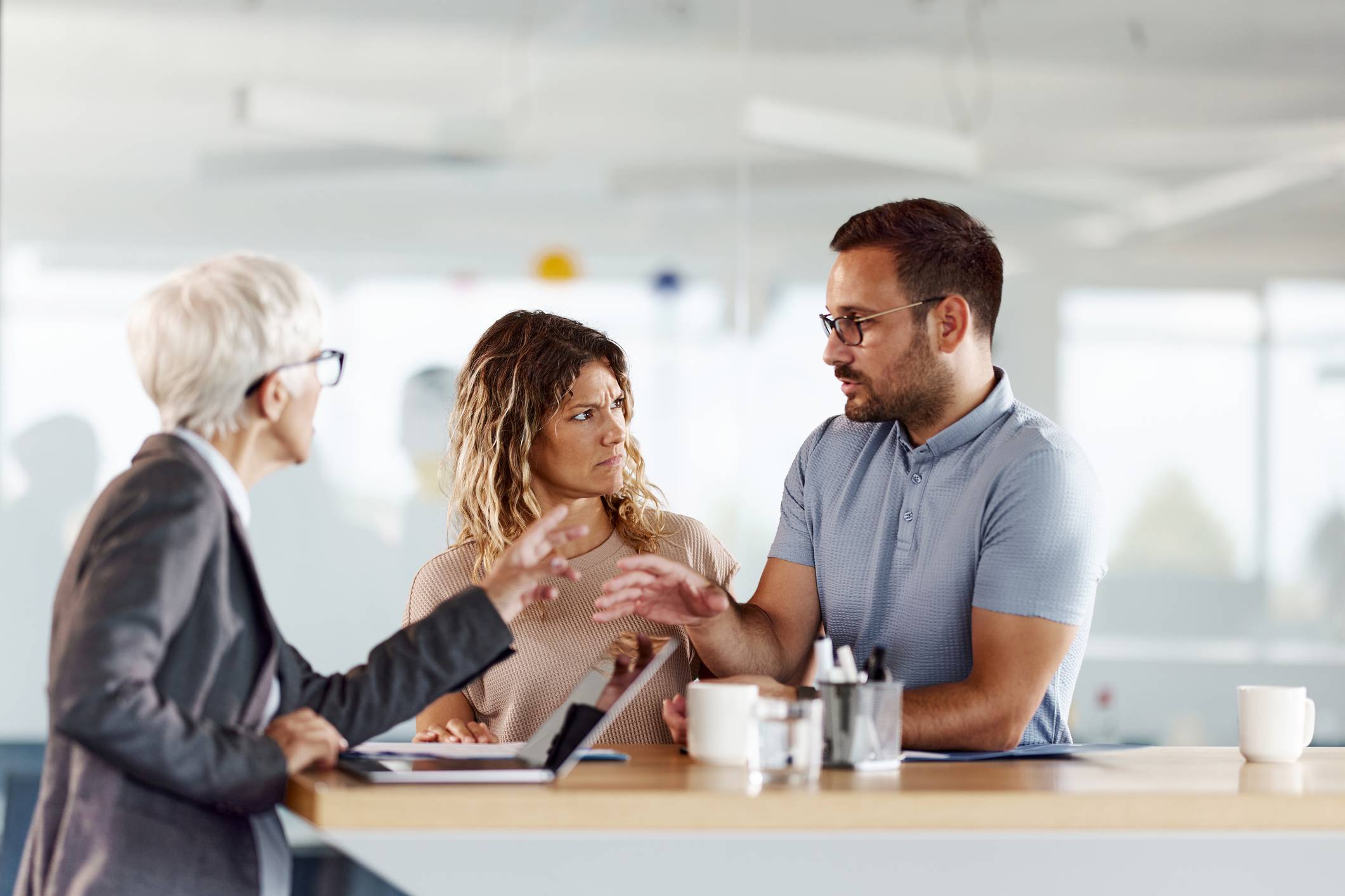 Coworkers-fighting-over-work-at-office-absenteeism