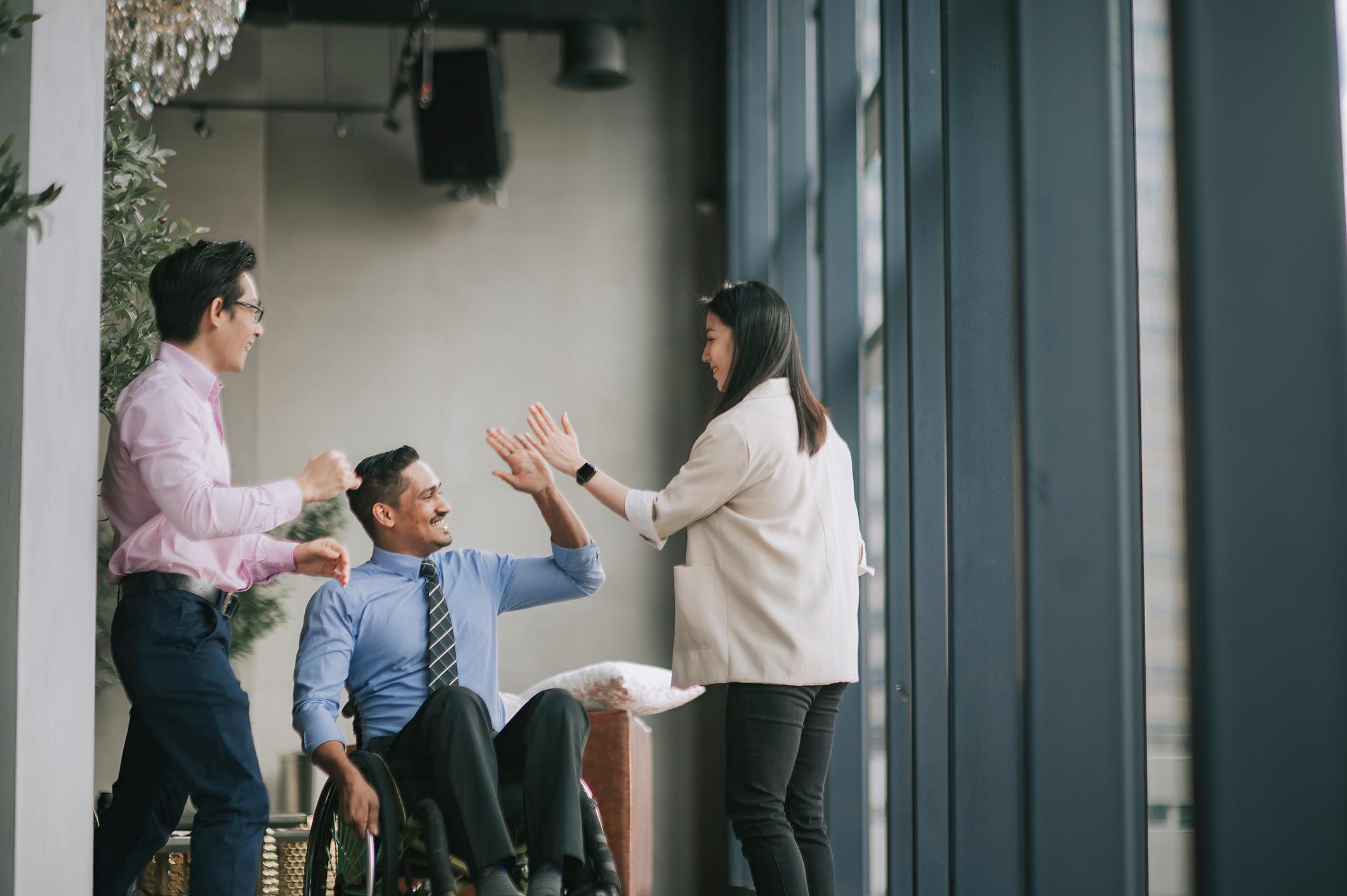 Coworkers-giving-high-five-to-each-other-upward-communication