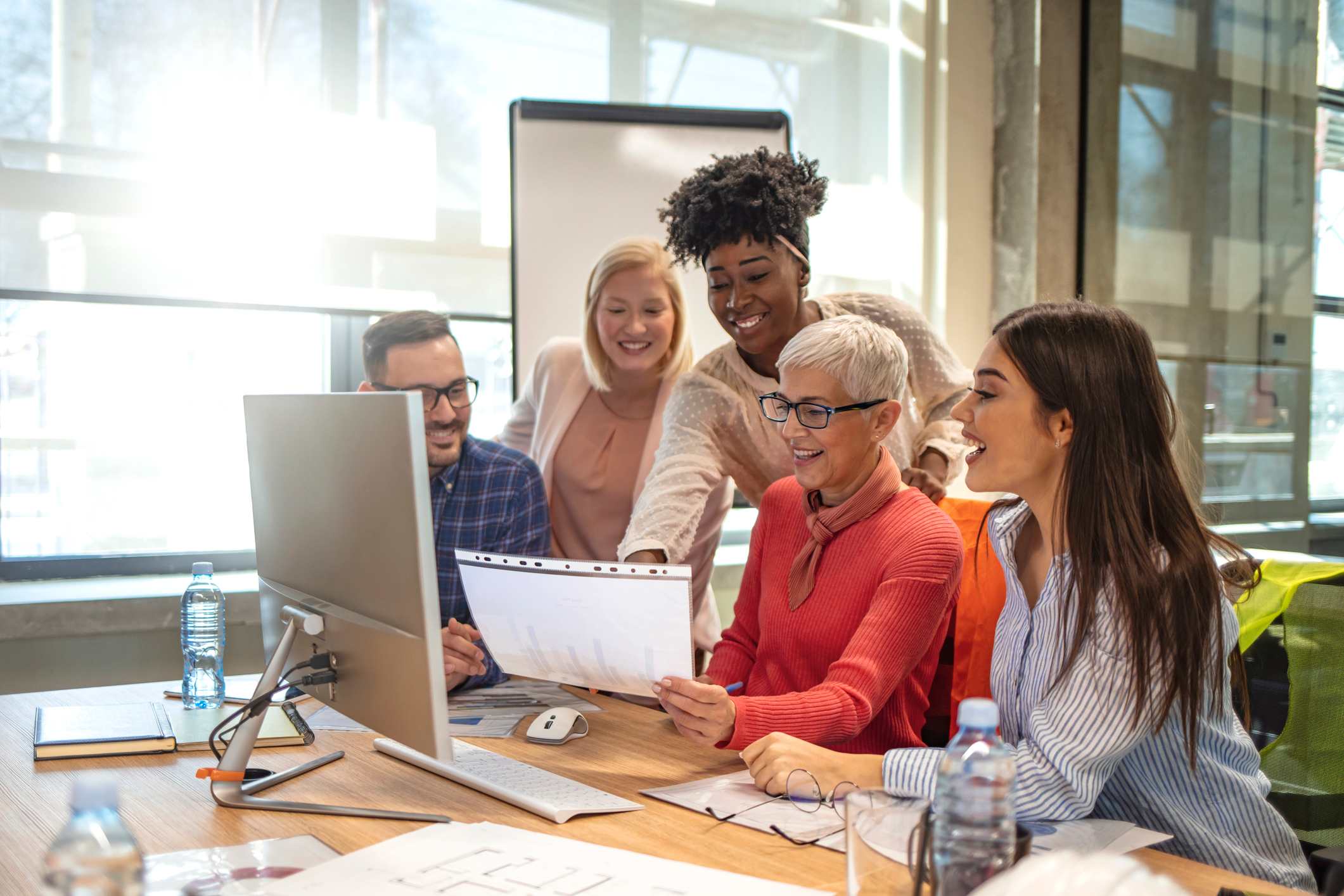 Coworkers-looking-at-printed-document-types-of-innovation