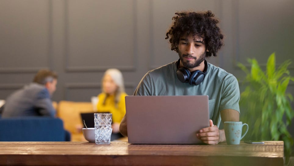 Creative-businessman-using-laptop-in-co-working-space-characteristics-of-a-determined-person