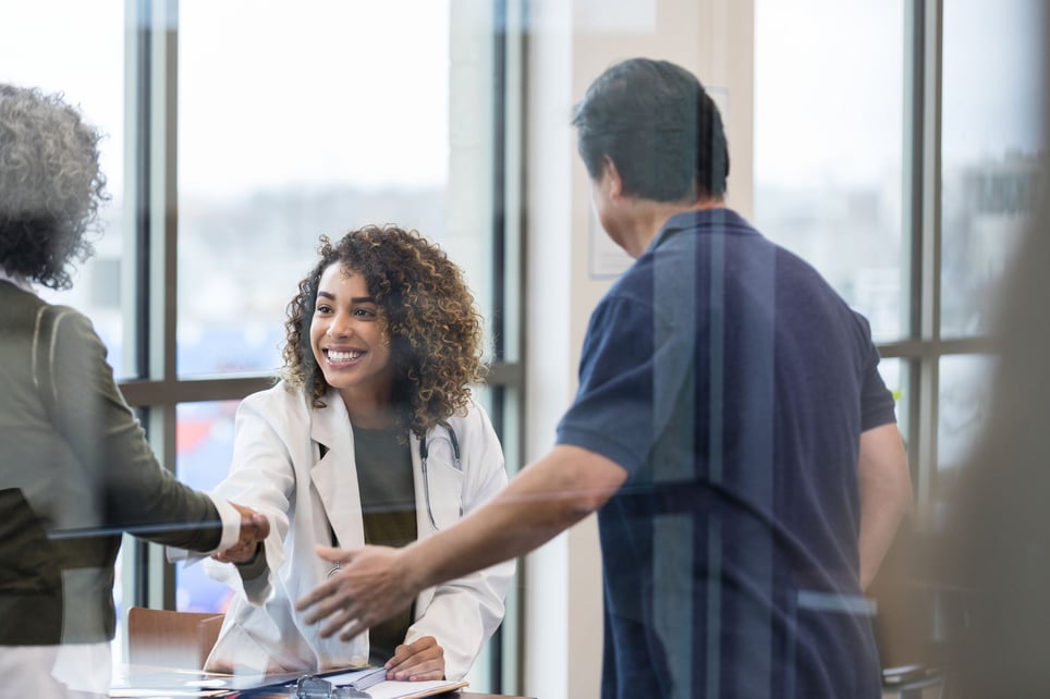 Doctor-shaking-hands-introducing-herself-how-to-create-social-goals