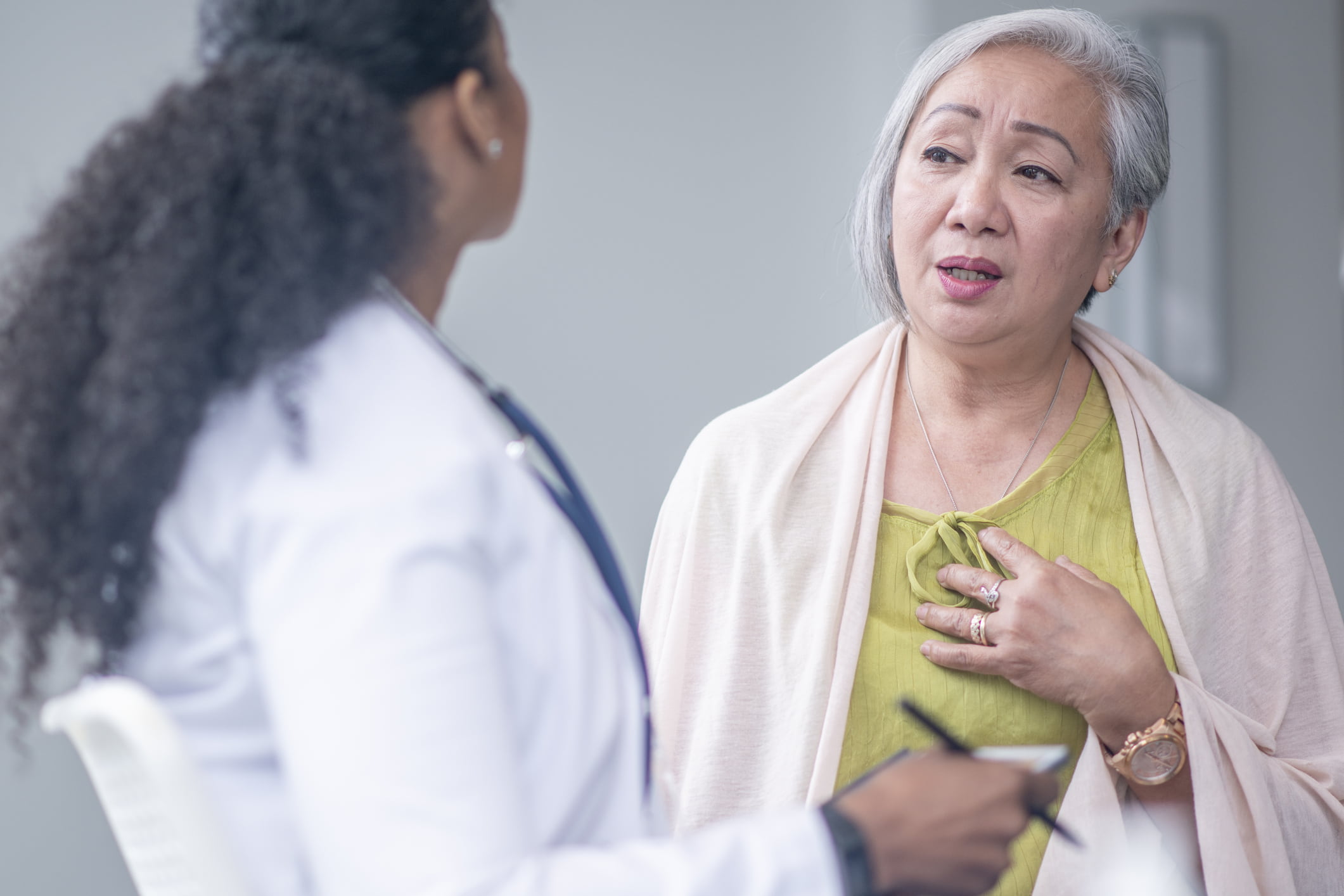 Elderly-woman-discussing-heart-disease-risks-with-younger-doctor——revenge-bedtime-procrastination