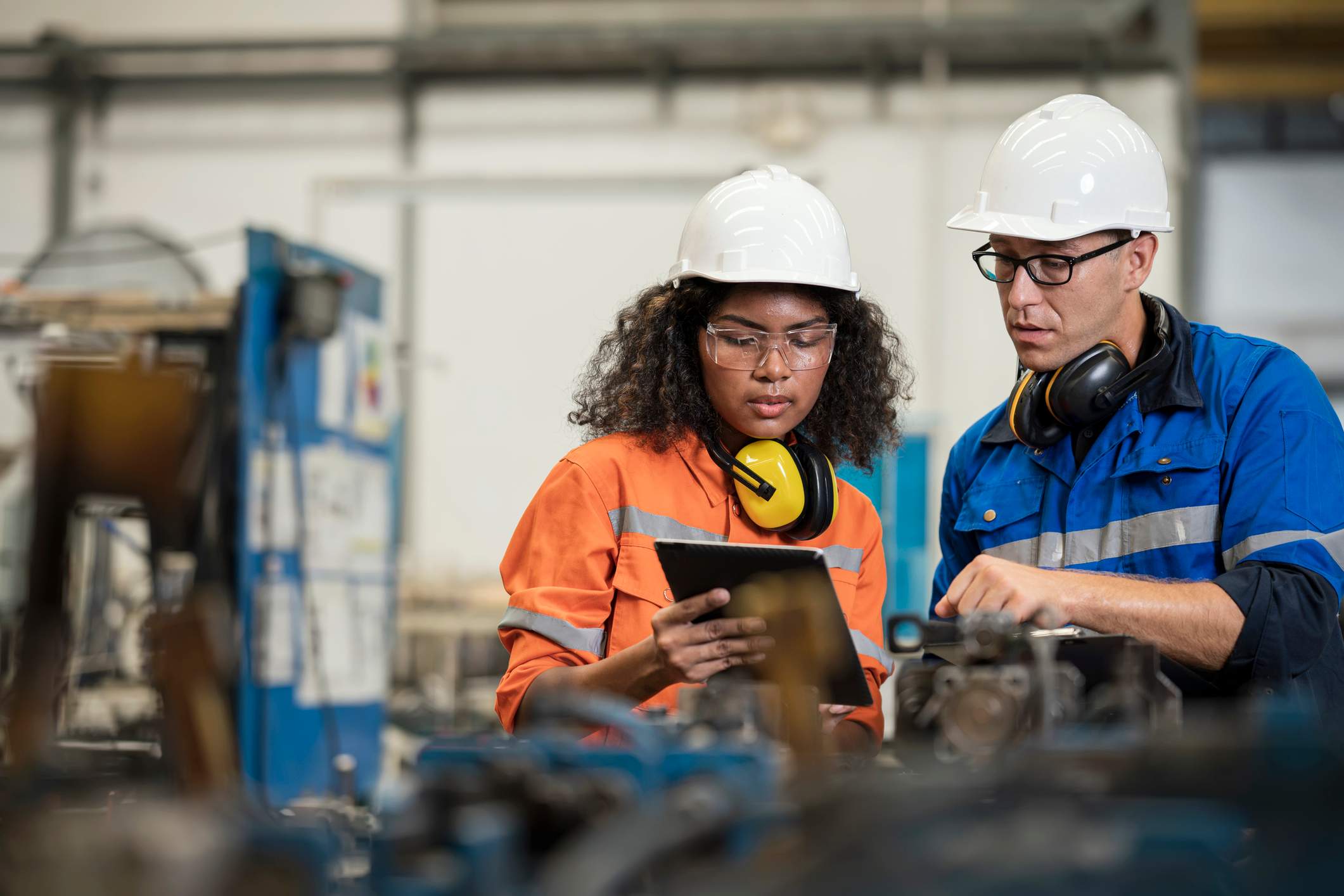 Engineers-looking-at-tablet-together-with-thei-protective-gear-why-is-there-a-labor-shortage