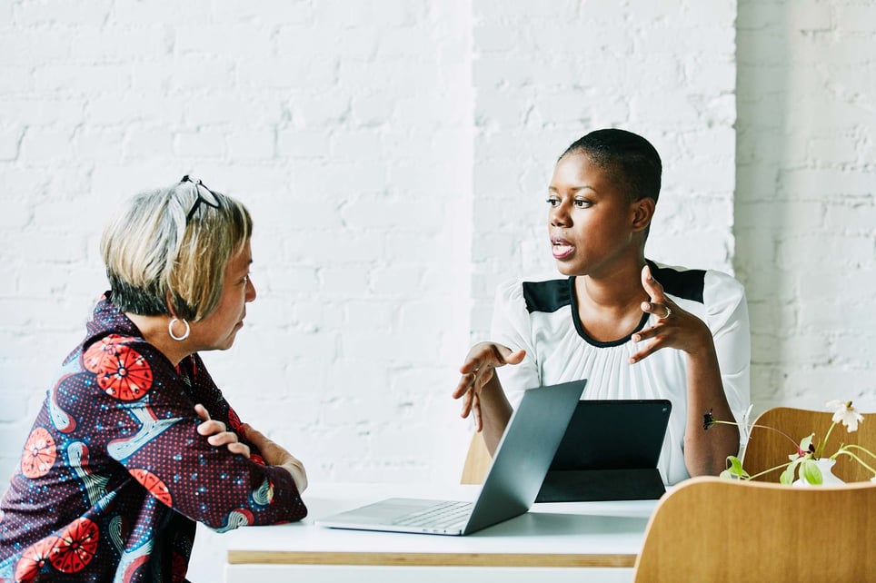 Female-financial-advisor-in-discussion-with-client-how-to-find-a-mentor