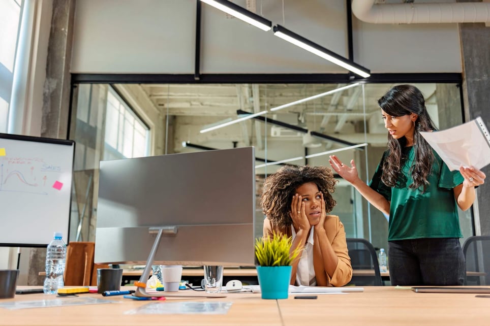 Frustrated-woman-being-scolded-by-manager-passive-aggressive-boss