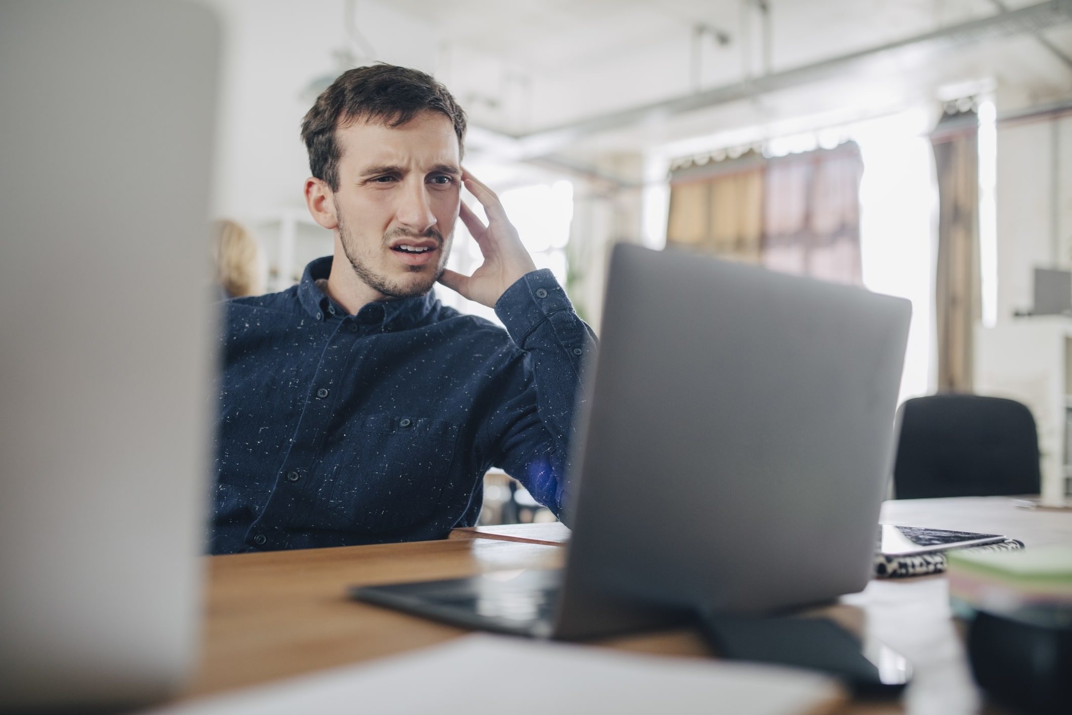 confused-businessman-looking-at-laptop-purpose-of-career-counseling