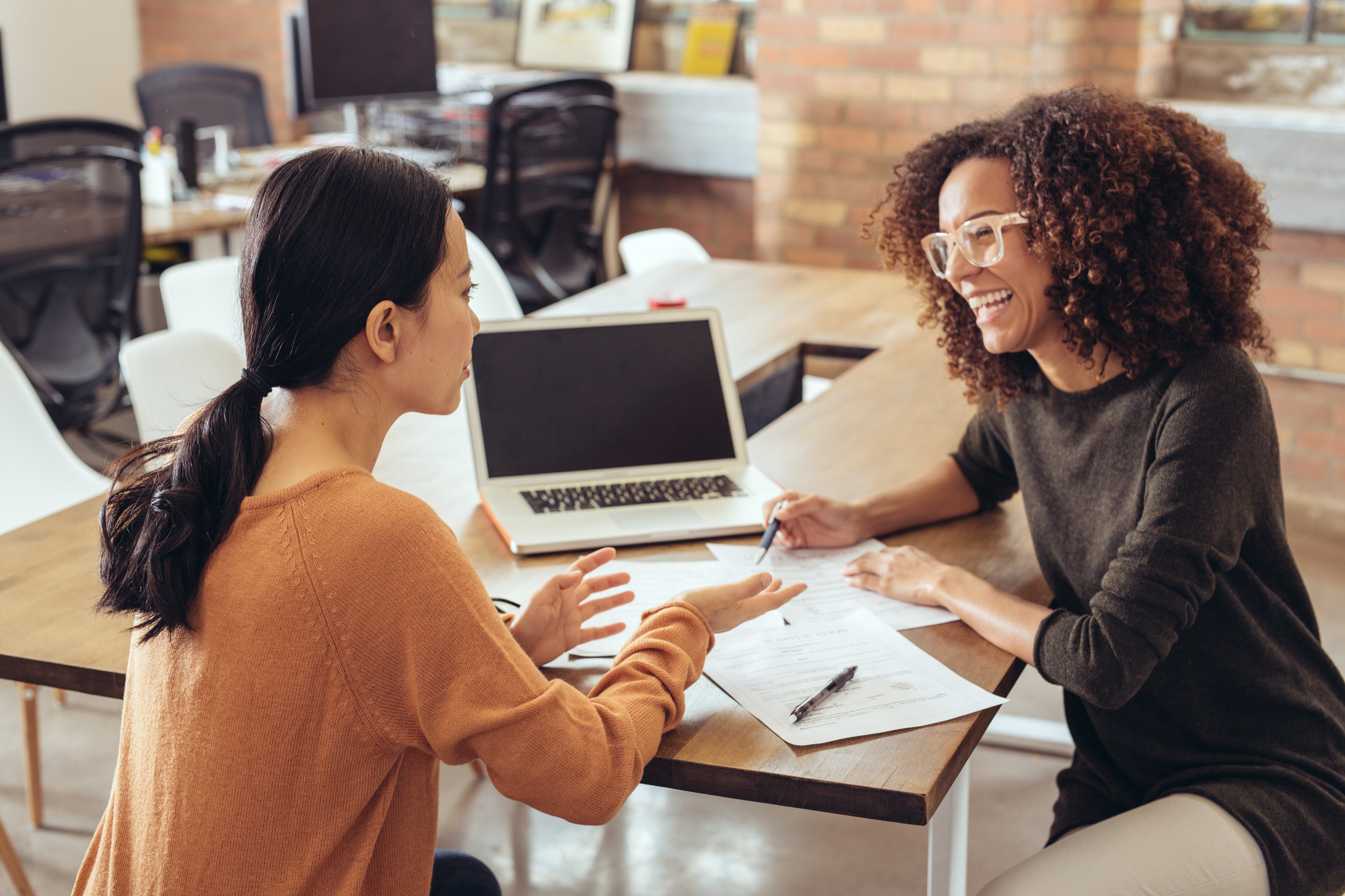 happy-coworkers-meeting-strategy-versus-tactics