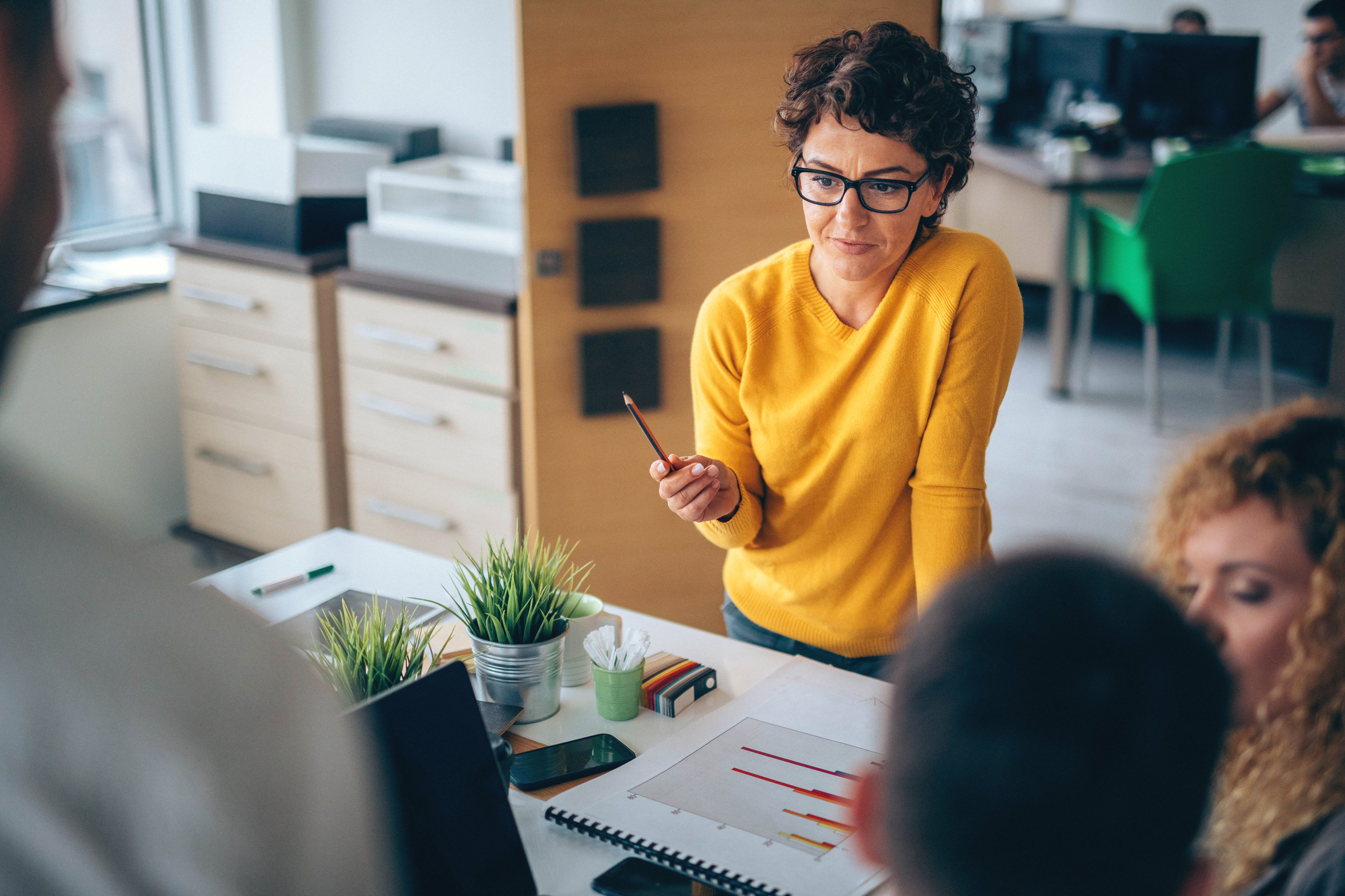 woman-presenting-meeting-strategy-versus-tactics