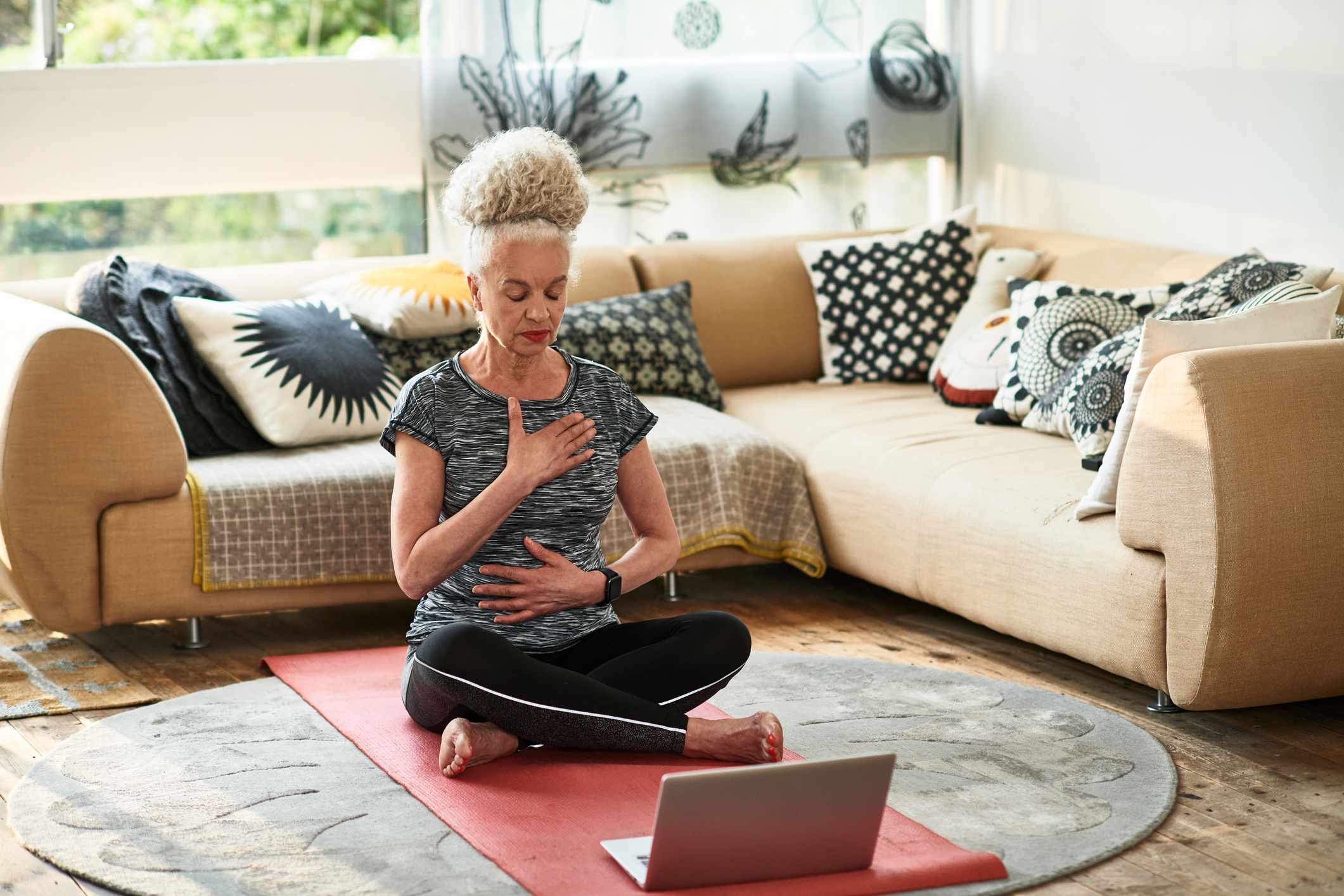 Grey-haired-woman-meditating-at-home-how-to-start-over-in-life-at-50