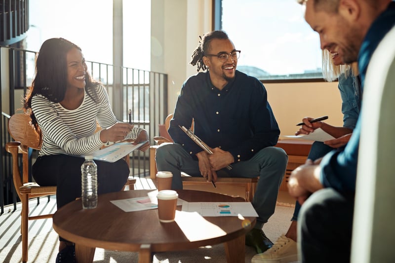 Group-Of-Office-Colleagues-Laughing