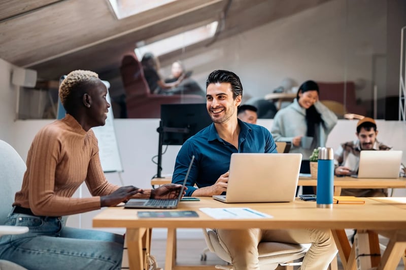 Happy-Coworkers-In-Office-peer-vs-colleague