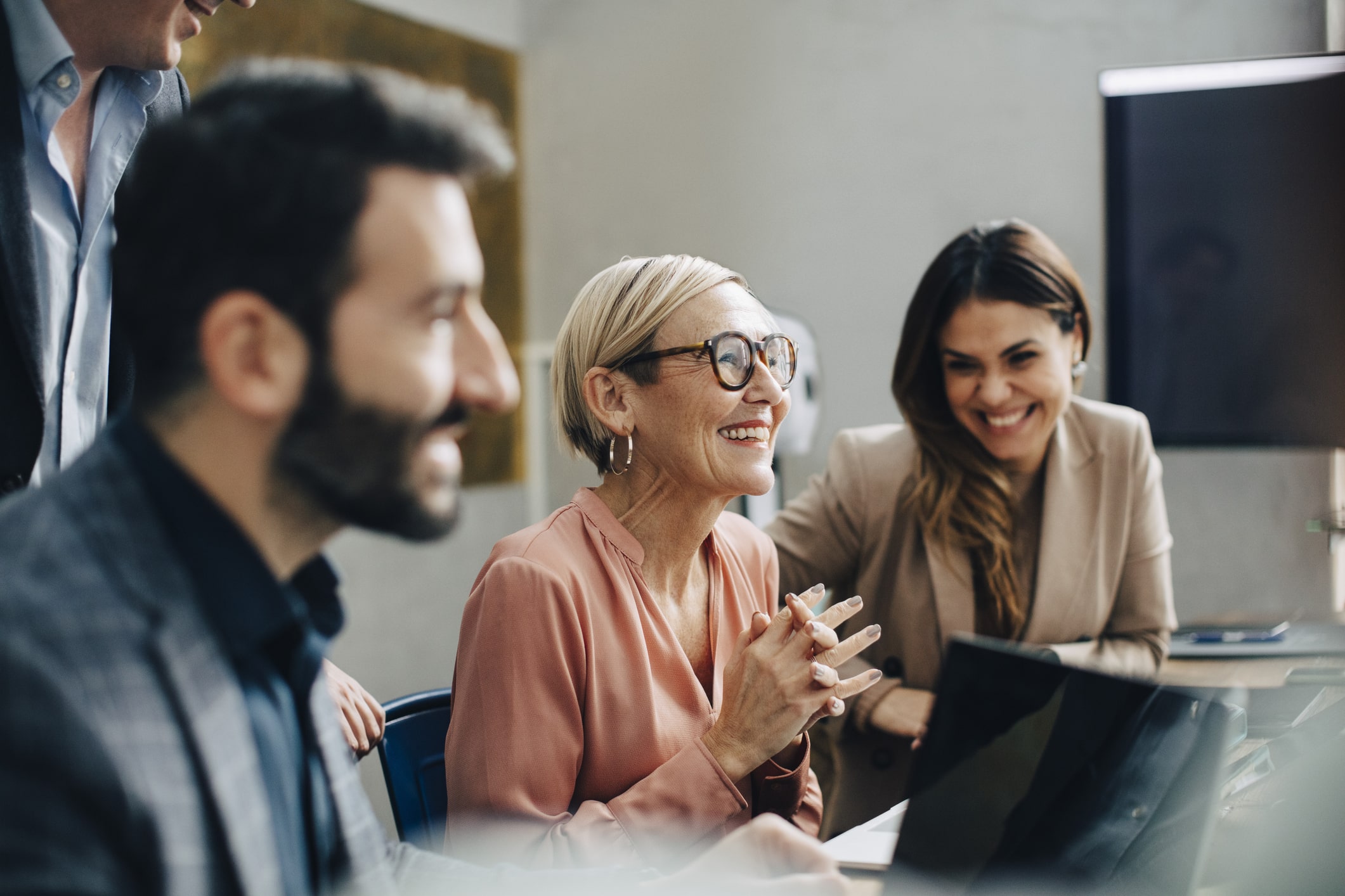 Happy-business-people-discussing-during-meeting-the-importance-of-knowing-yourself