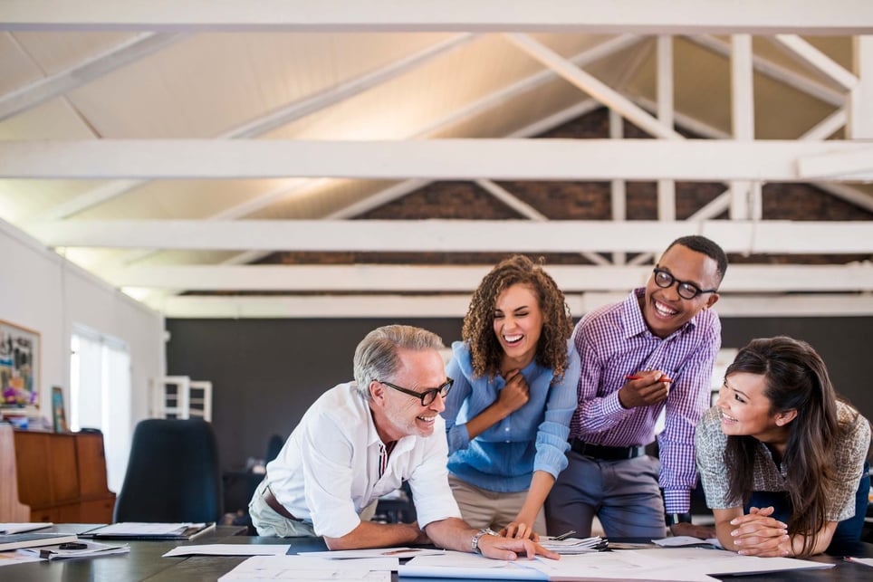 Happy-business-people-working-in-office-what-are-happy-hormones