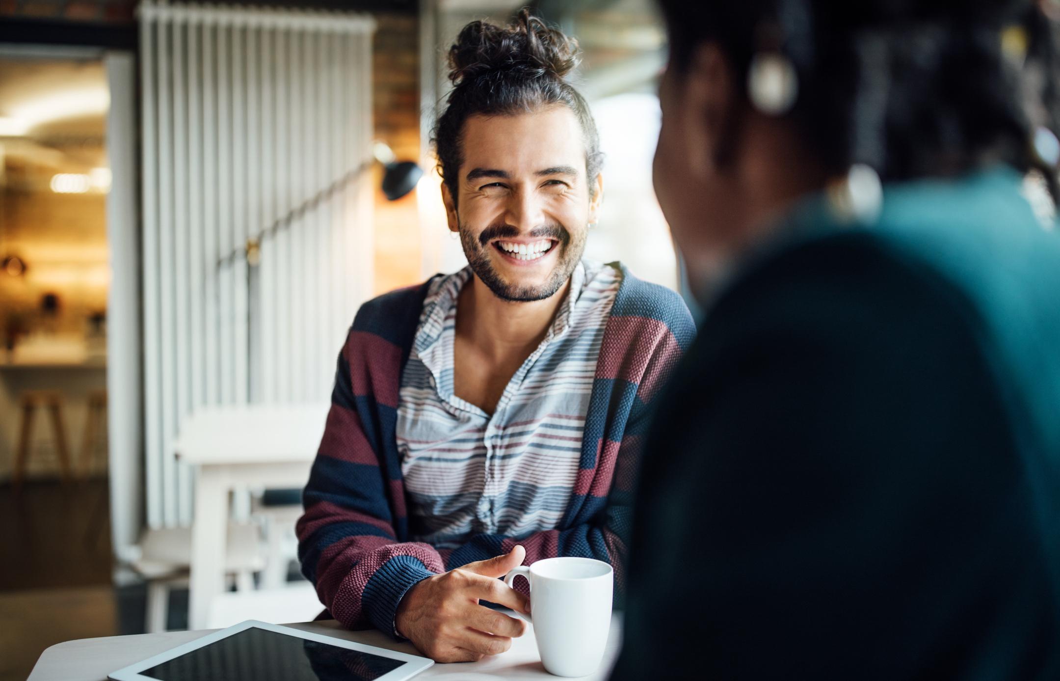 Happy-businessman-having-coffee-with-colleague-anger-management-strategies