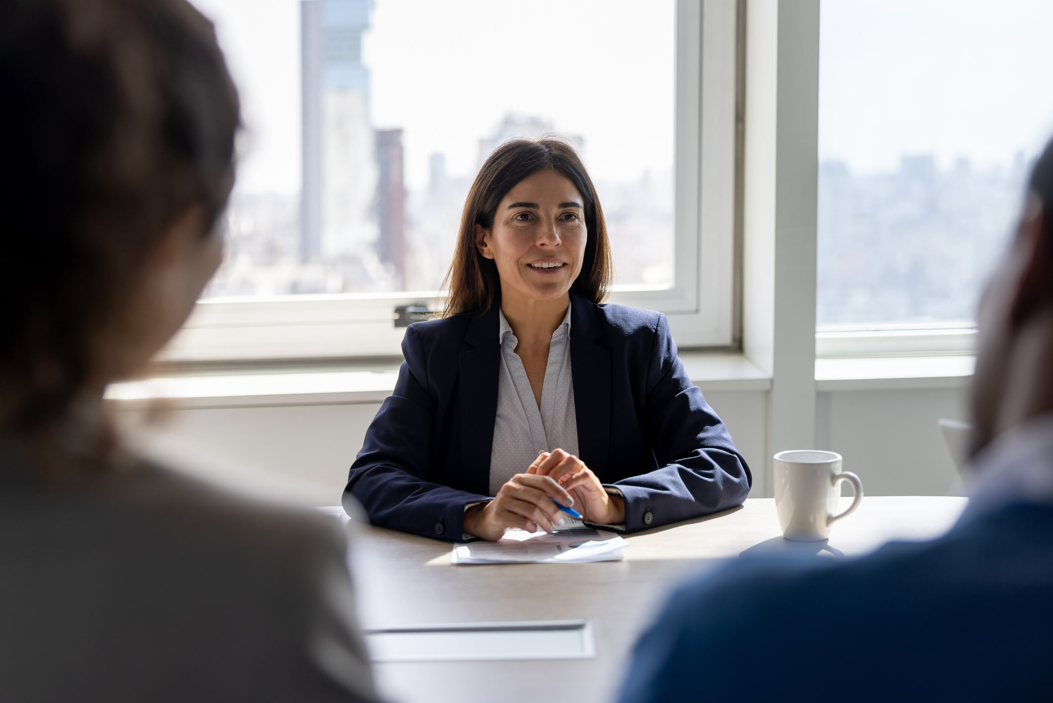 Happy-businesswoman-at-job-interview-how-do-you-like-to-be-managed