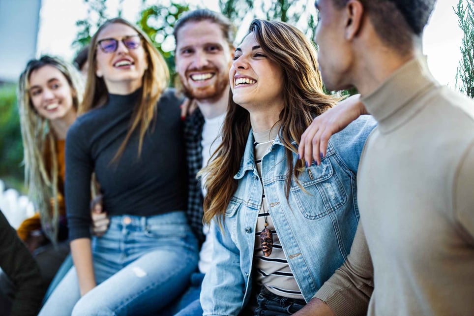 Happy-group-of-millennials-smiling-and-talking-how-to-choose-my-own-life-path-as-a-millennial