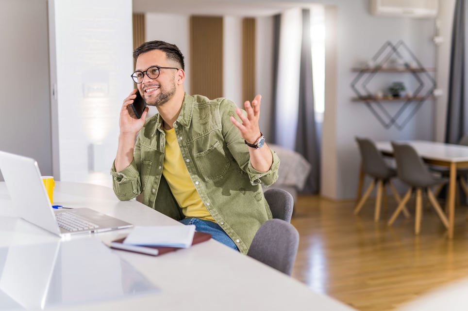 Happy-young-man-working-phone-screen-interview