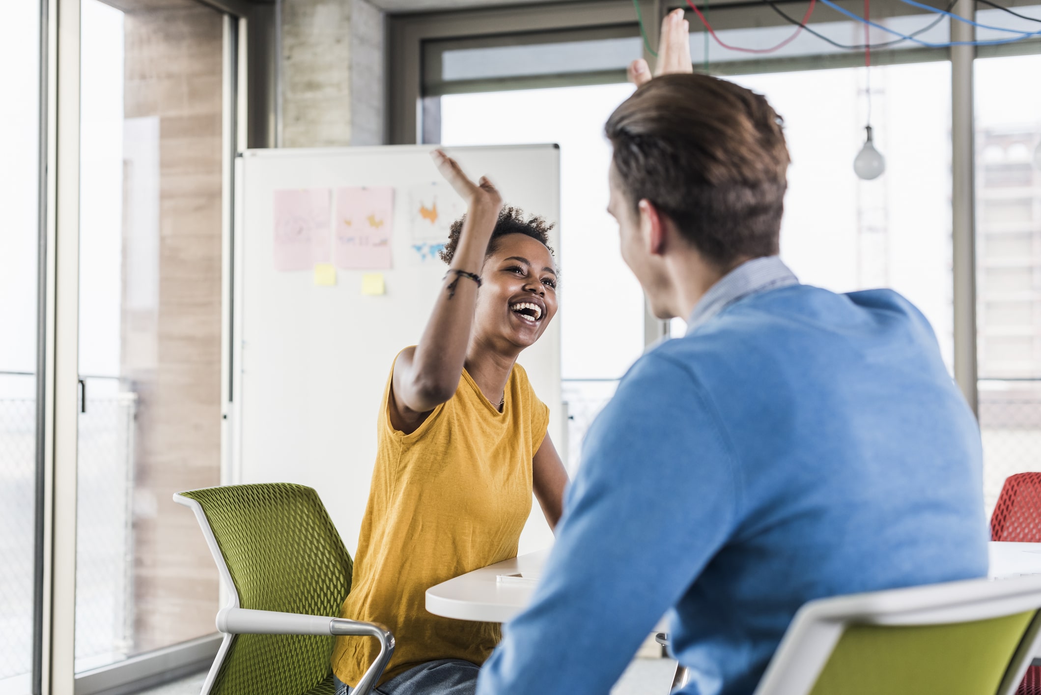 Happy-young-woman-high-fiving-with-colleague-in-office-find-your-purpose