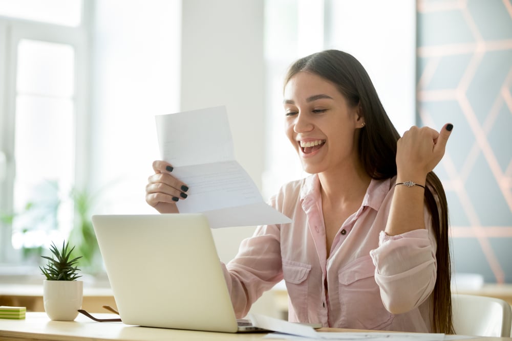 Happy-young-woman-student-or-employee-excited-by-reading-good-news-best-work-from-home-jobs-for-moms