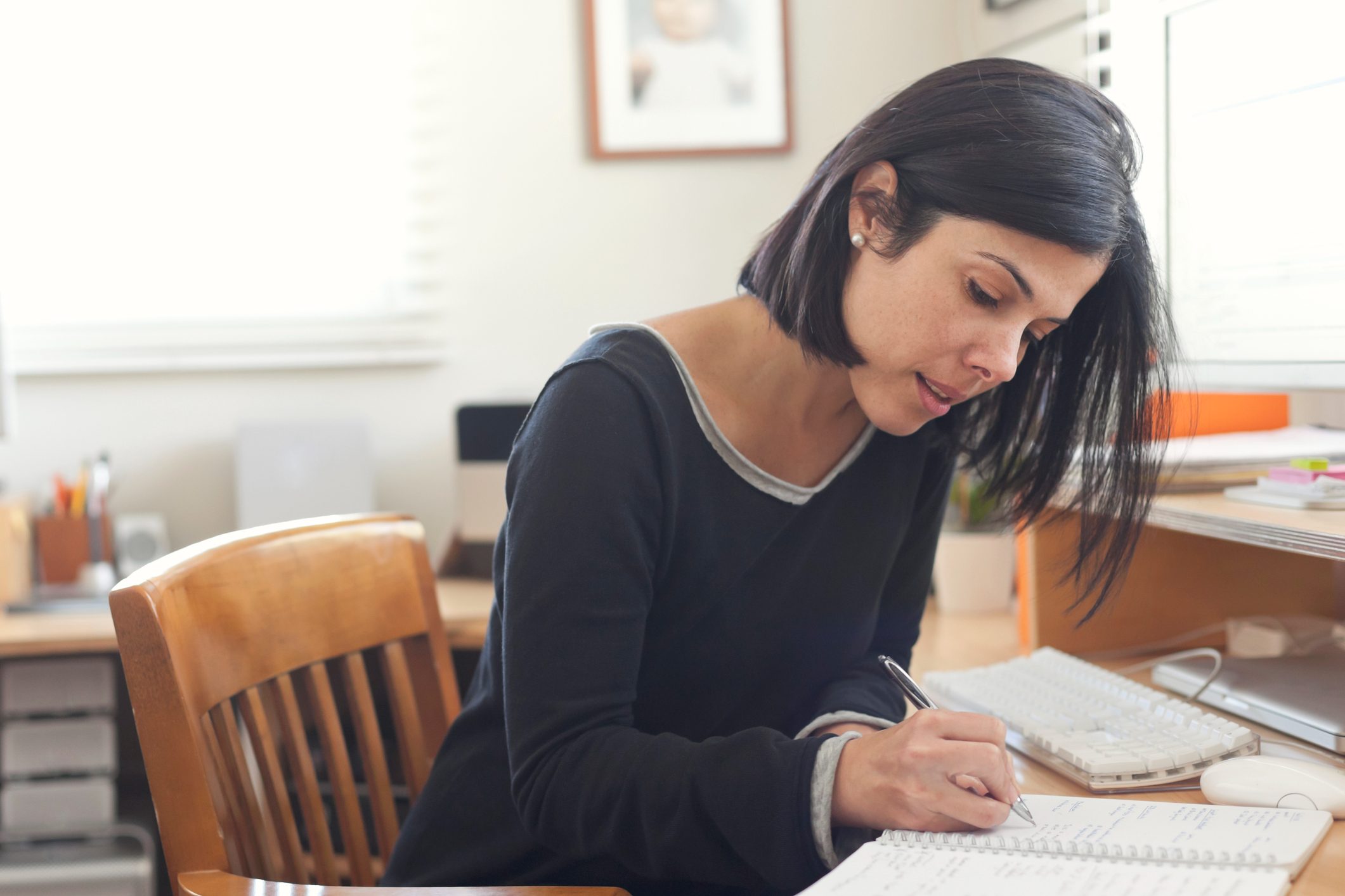 Hispanic-woman-working-in-home-office-why-do-you-want-this-job