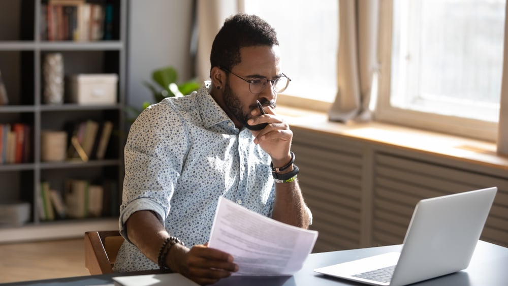 Male-thinking-in-front-of-laptop-work-life-balance-in-startups