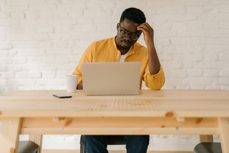 Man-Working-On-His-Laptop-how-to-cold-connect-on-Linkedin