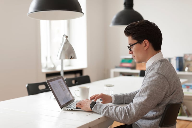 Man-Working-On-Laptop-In-Office-overqualified-for-job