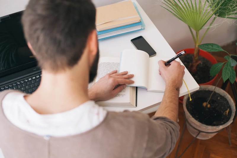 Man-Writing-In-His-Journal-At-Home-what-do-i-want