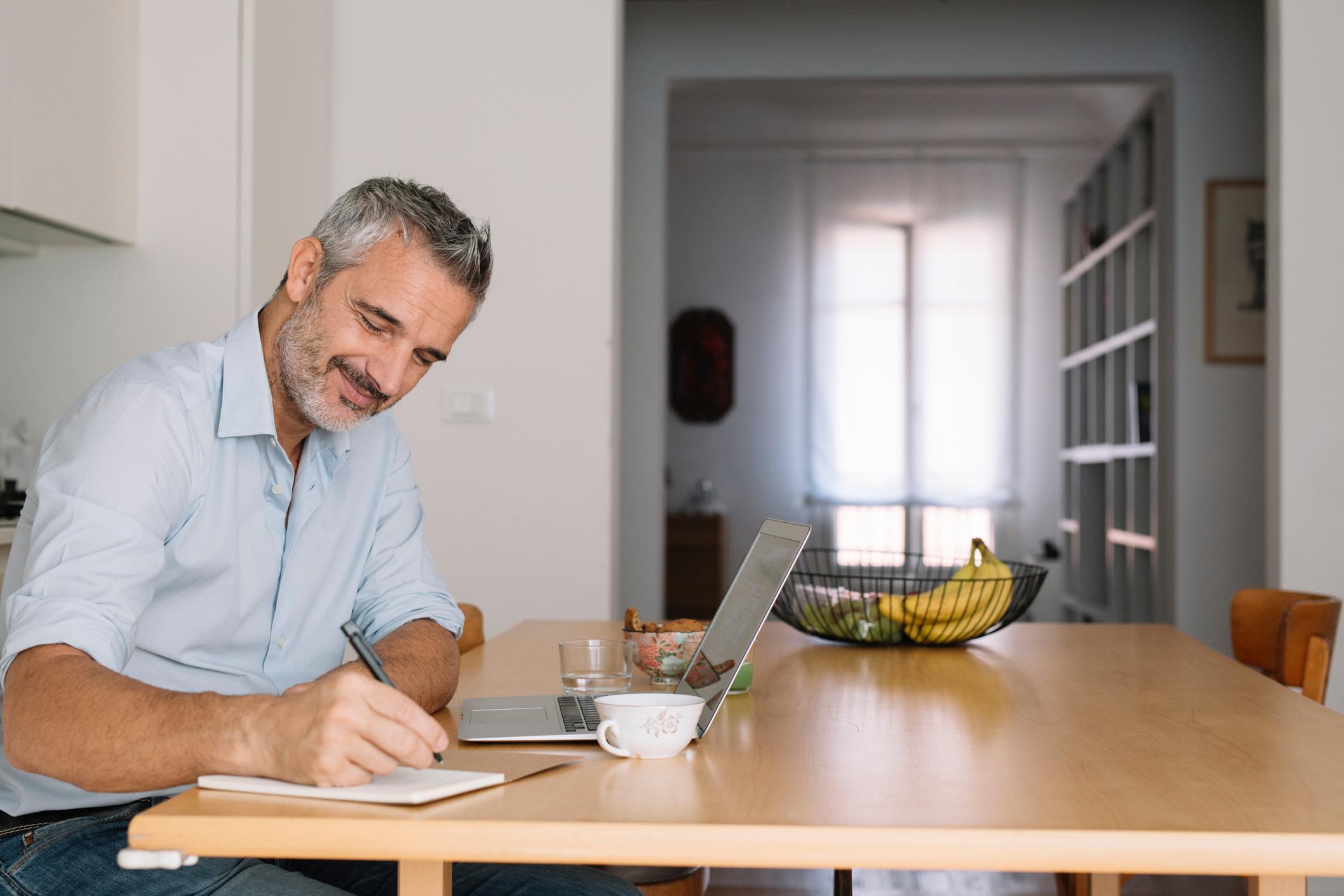 Man-doing-research-on-laptop-at-his-house-subject-matter-expert