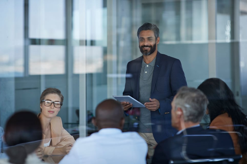 Man-giving-conference-at-an-office-subject-matter-expert