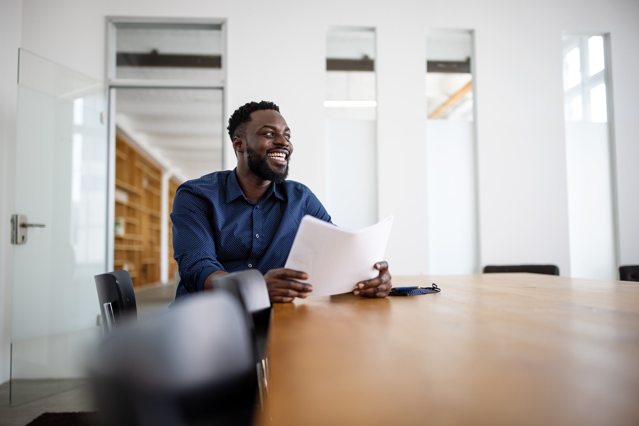 Man-happy-about-the-papers-he-just-read-structured-interview